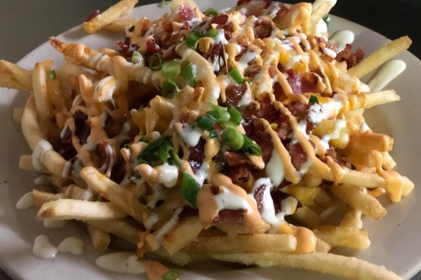 Fries with melted cheese, bacon, chipotle bbq sauce and ranch dressing